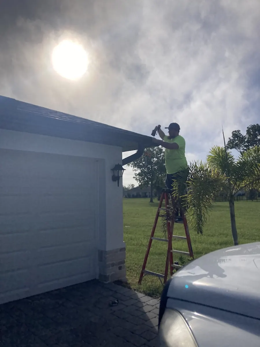 WWJD Gutters technician installing gutters in SW Florida